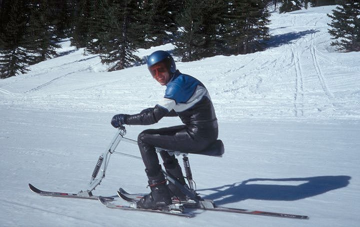 Kevan Leycraft riding the "leading link with coil-over" dampened front ski with the free <br />hinged floating frame... whatever, it's a skibike! Lake Louise, 1990.