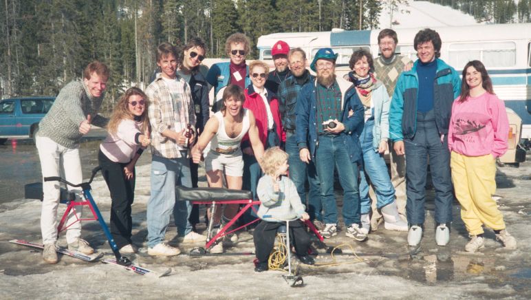 Big crowd scene after the races. Andrew Borgsteede, Alice Ritchie, Dann Rogers, Mark Lux, Doug Ritchie, Kevan Leycraft, <br />Nancy Jerrard, Bill Comer, Fred Peterson, Ron Mickelberry, Linda Mickelberry, Ian Watson, Joe Racer, Mikki Leycraft <br />and Charlie Leycraft on micro-bike in front. Lake Louise, Alberta. Spring, 1991.